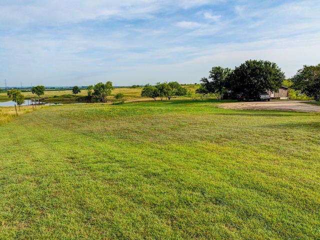 view of yard with a rural view