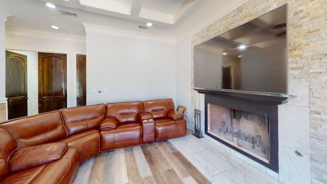 living room with light hardwood / wood-style floors and ornamental molding