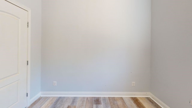 unfurnished room with light hardwood / wood-style flooring