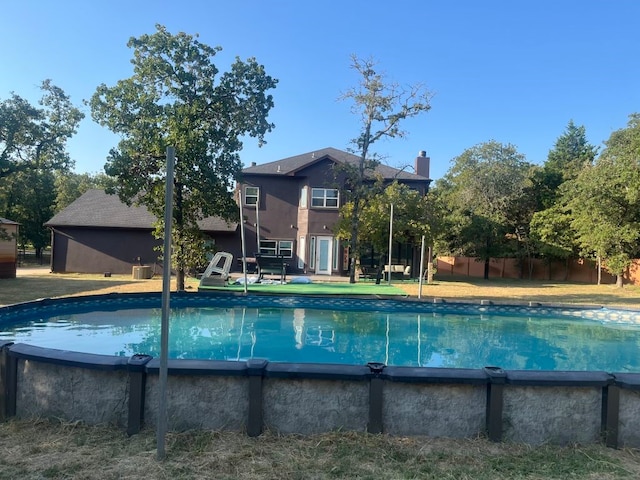 view of swimming pool featuring central AC