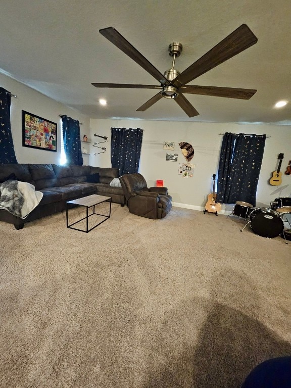 carpeted living room featuring ceiling fan