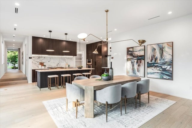 dining room with light hardwood / wood-style floors