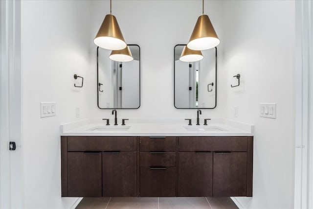 full bathroom featuring double vanity and a sink