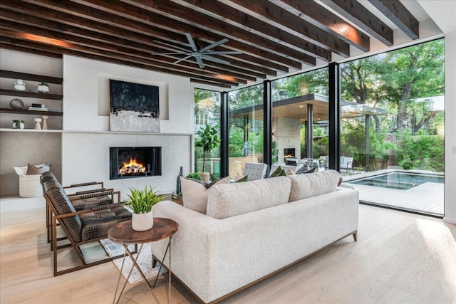 living room featuring hardwood / wood-style flooring and floor to ceiling windows