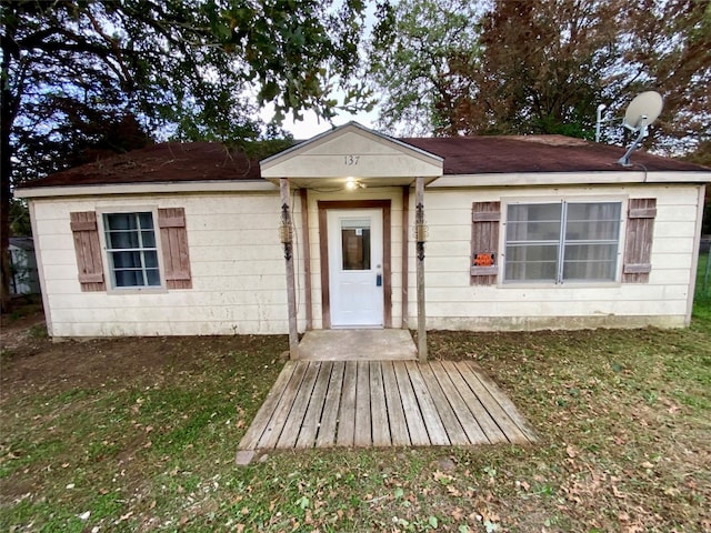 ranch-style house with a front lawn