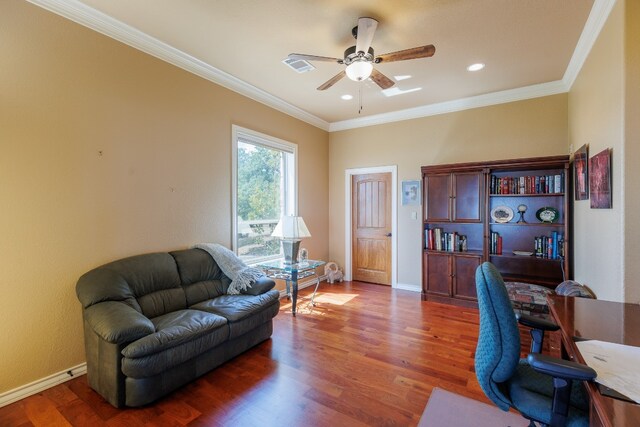 office area featuring ceiling fan, dark wood-type flooring, and ornamental molding