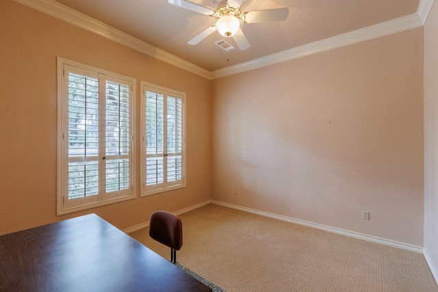 unfurnished office featuring ceiling fan, crown molding, and carpet