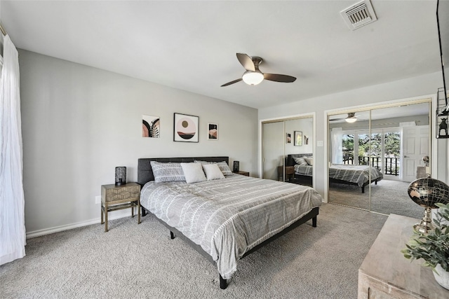 bedroom featuring multiple closets, ceiling fan, and carpet floors