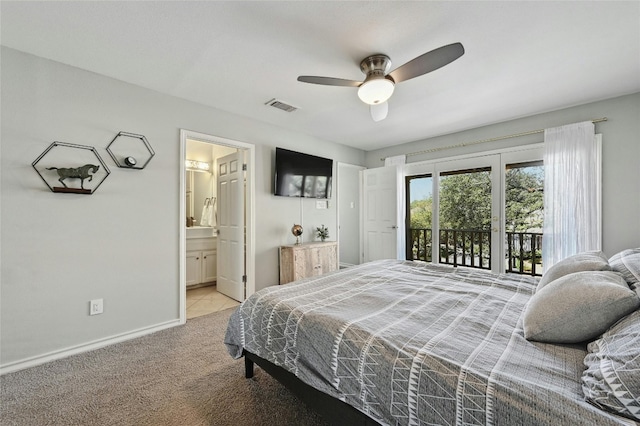 carpeted bedroom with ceiling fan, connected bathroom, and access to exterior