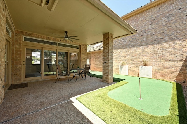 view of patio featuring ceiling fan