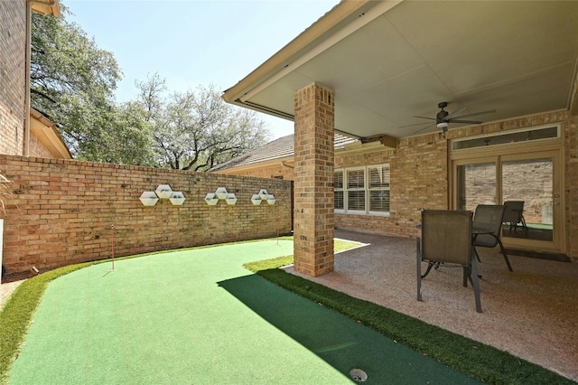 view of patio featuring ceiling fan