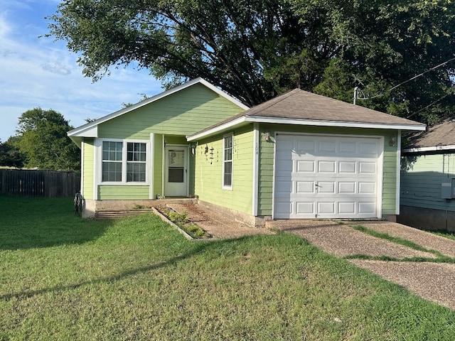 view of front of house featuring a front yard and a garage