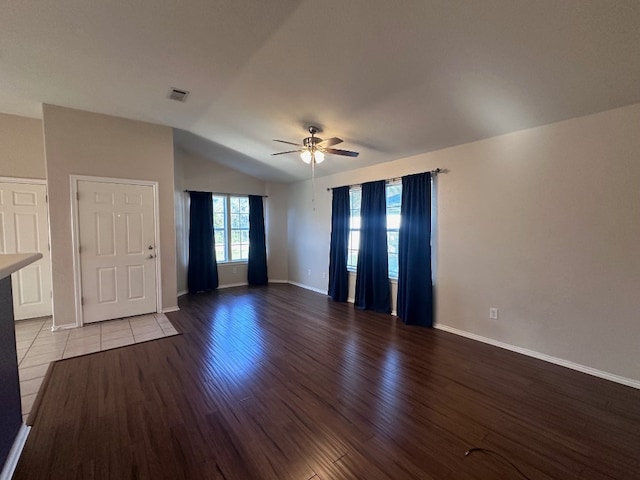 unfurnished room featuring light hardwood / wood-style flooring, lofted ceiling, and ceiling fan