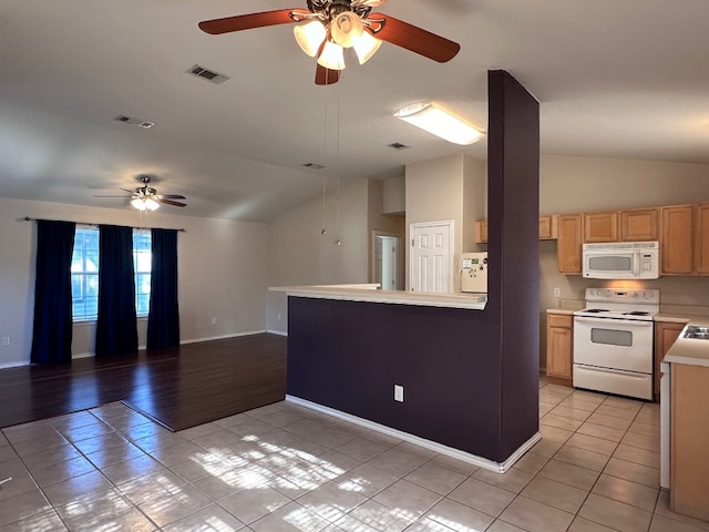 kitchen with ceiling fan, light tile patterned flooring, vaulted ceiling, and white appliances