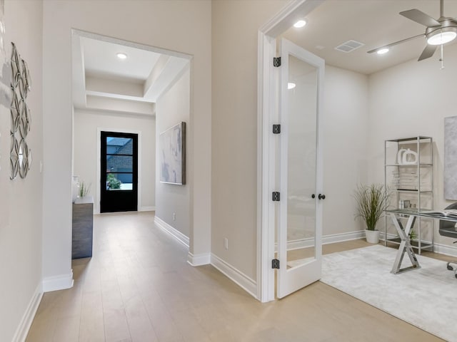 corridor featuring french doors and wood-type flooring