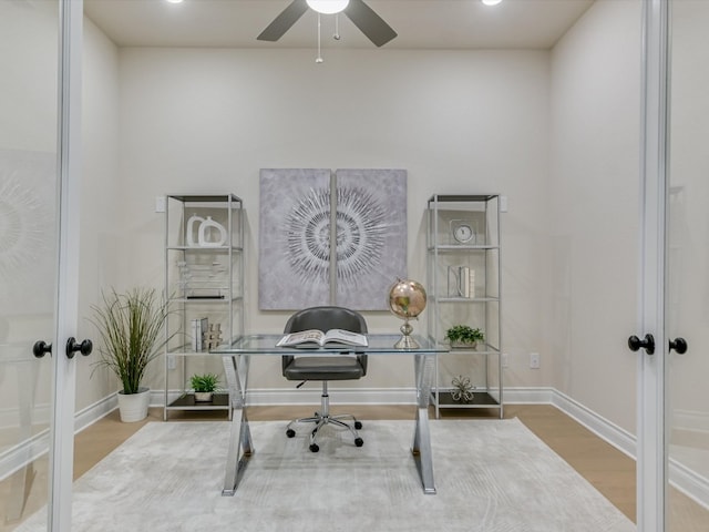 office featuring ceiling fan, french doors, and hardwood / wood-style floors