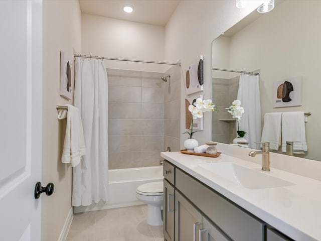 full bathroom featuring shower / bathtub combination with curtain, vanity, tile patterned flooring, and toilet