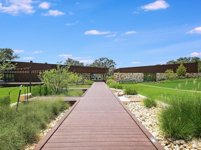 view of home's community with a lawn