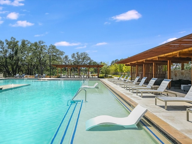 view of swimming pool with a pergola and a patio area