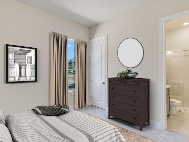 bedroom with light colored carpet and ensuite bathroom