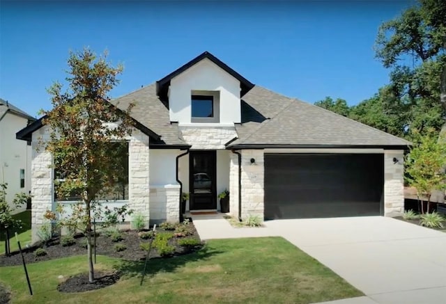 view of front of property with stone siding, driveway, an attached garage, and a shingled roof