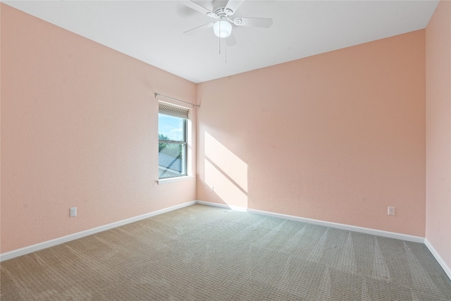 spare room with ceiling fan and carpet floors