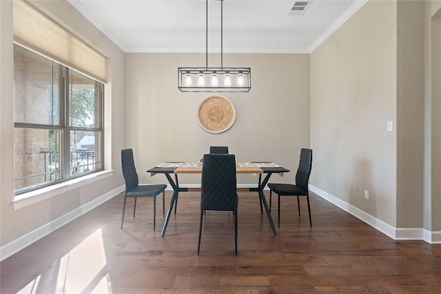 dining room with a wealth of natural light, dark wood-type flooring, and ornamental molding