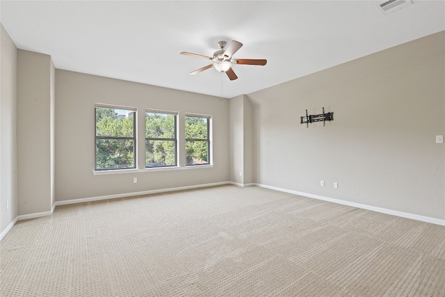 carpeted empty room with ceiling fan