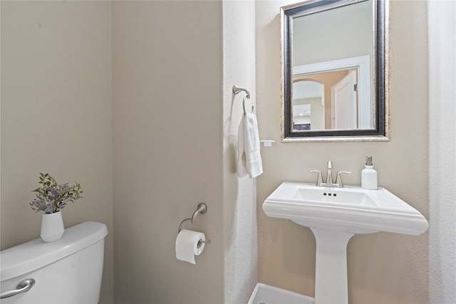 bathroom with sink and toilet