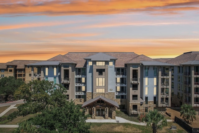 view of outdoor building at dusk