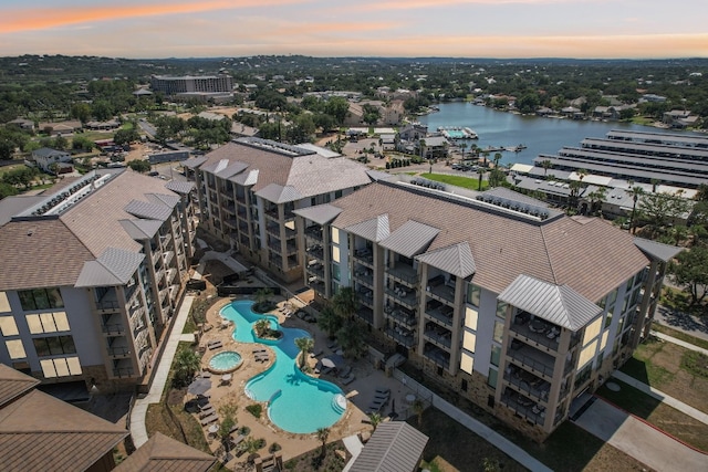 aerial view at dusk with a water view