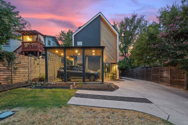 back house at dusk with a yard