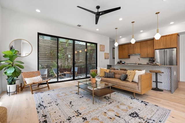 2118 Glendale Pl Unit 1, Austin, TX 78704 - living area with light wood-type flooring, a ceiling fan, and recessed lighting