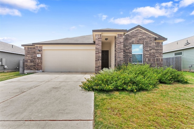 view of front of house with a garage and a front lawn