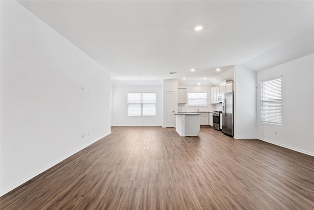 unfurnished living room featuring hardwood / wood-style floors