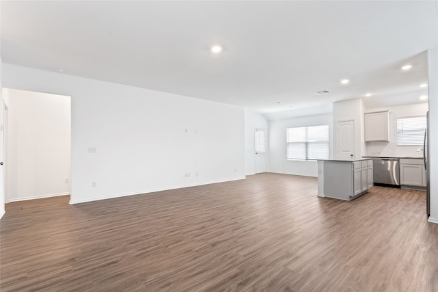 unfurnished living room with hardwood / wood-style flooring