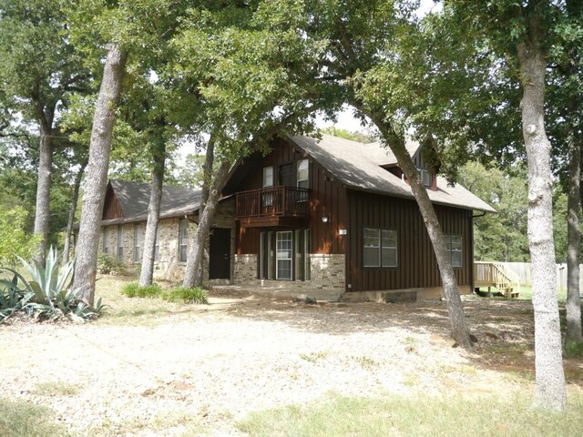 rear view of house featuring a balcony