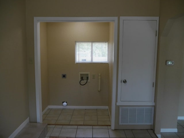 laundry area with hookup for a washing machine, light tile patterned floors, and electric dryer hookup