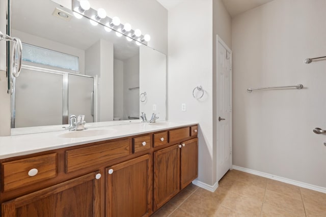 bathroom featuring tile patterned floors and double sink vanity