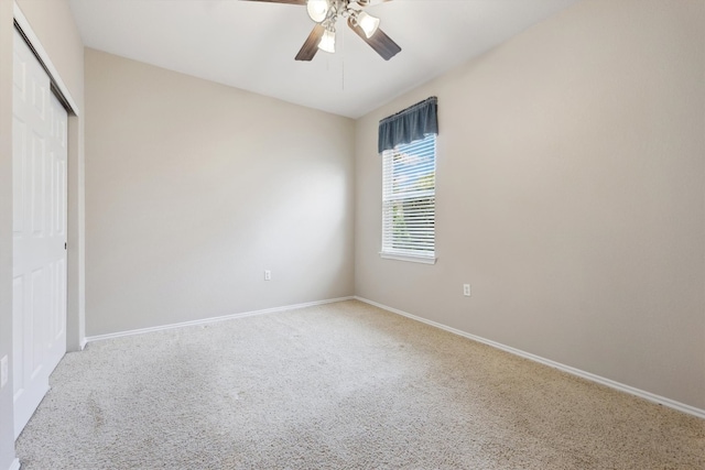 unfurnished bedroom featuring ceiling fan, a closet, and carpet