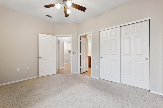 unfurnished bedroom with ceiling fan, light carpet, and a closet