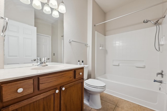 full bathroom with tiled shower / bath, vanity, toilet, and tile patterned flooring