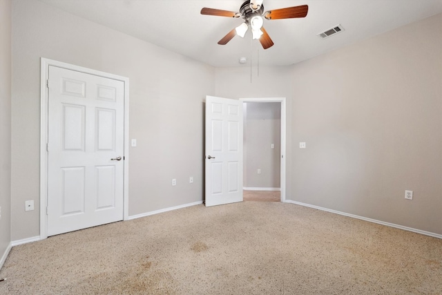 unfurnished bedroom featuring ceiling fan and carpet flooring