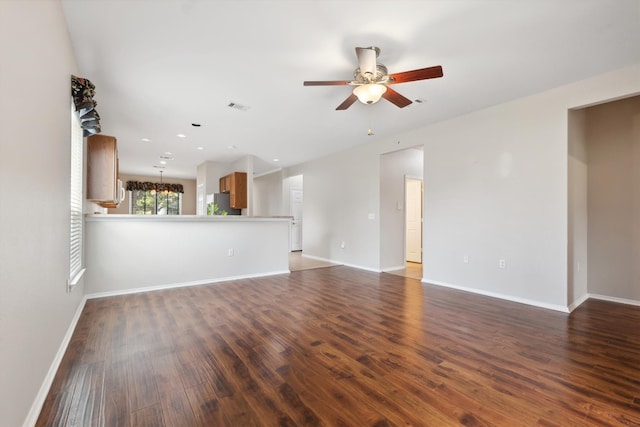 unfurnished living room featuring ceiling fan and wood-type flooring