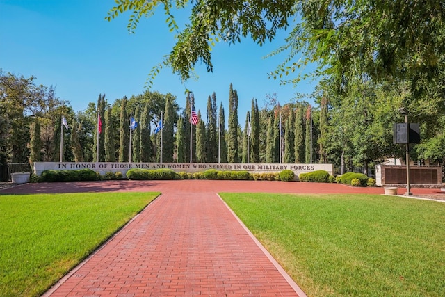 view of community featuring a yard