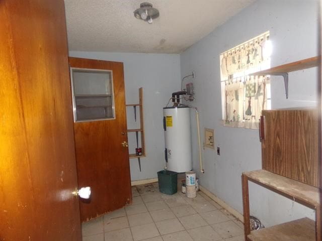 utility room featuring electric water heater