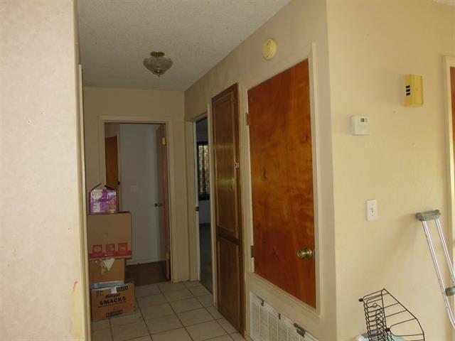 corridor with light tile patterned floors