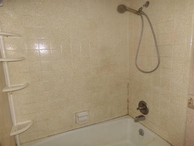 105 E Fawn Dr, Buchanan Dam, TX 78609 - bathroom featuring washtub / shower combination