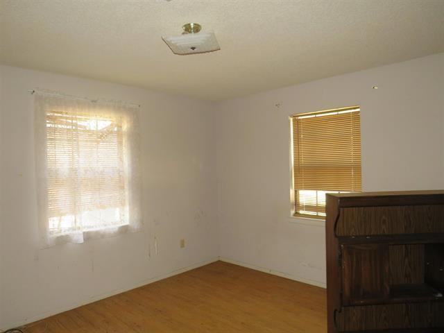 spare room with hardwood / wood-style flooring