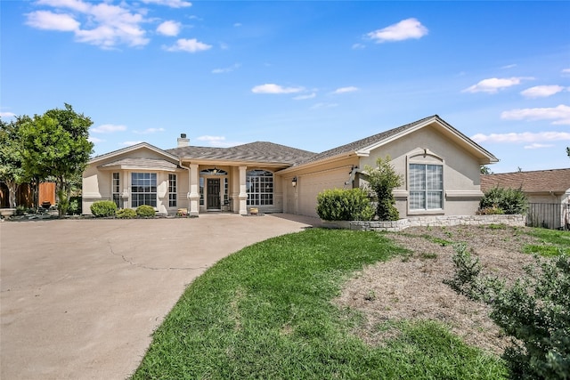 ranch-style home featuring a garage